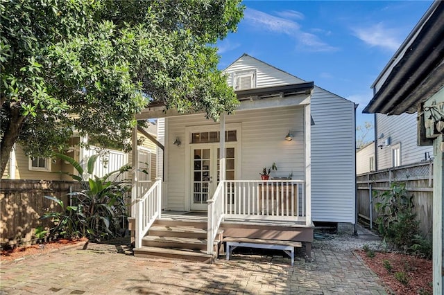 rear view of house with a patio and french doors