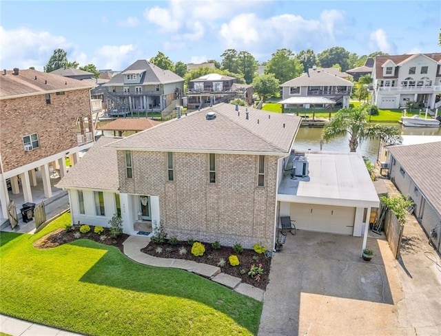 drone / aerial view with a residential view and a water view