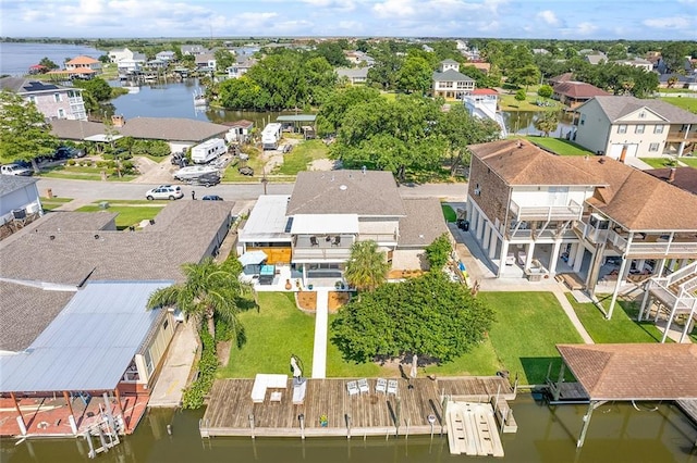 aerial view with a water view and a residential view