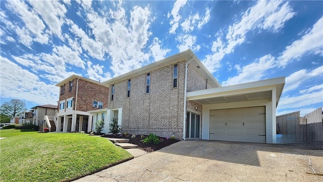 view of side of property featuring an attached garage, a yard, driveway, and brick siding