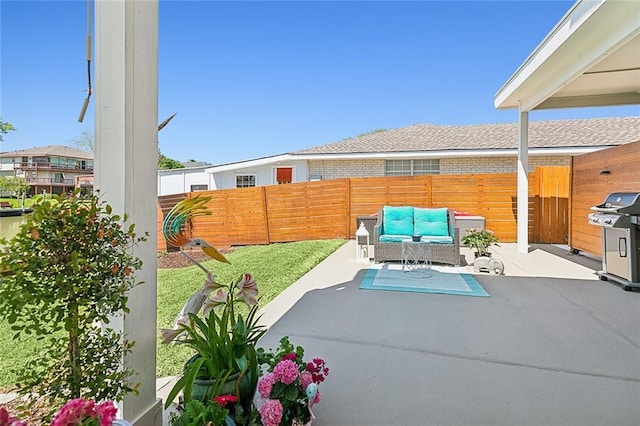 view of patio with outdoor lounge area, a fenced backyard, and area for grilling