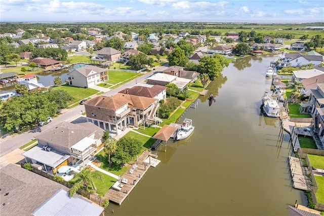 aerial view with a residential view and a water view