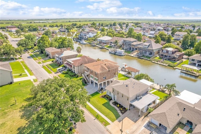 aerial view featuring a residential view and a water view