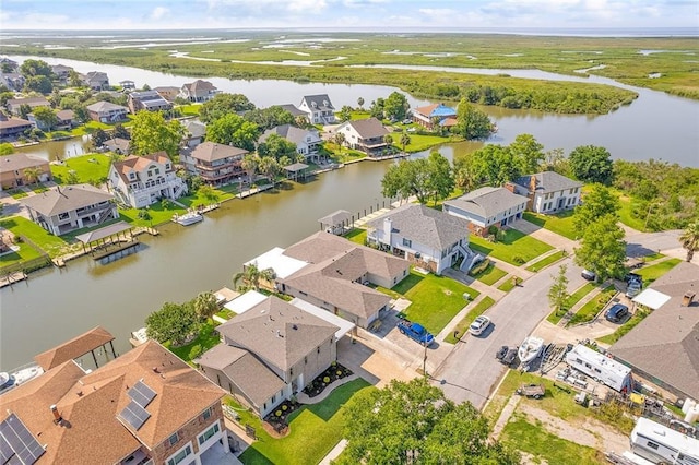 aerial view featuring a water view and a residential view