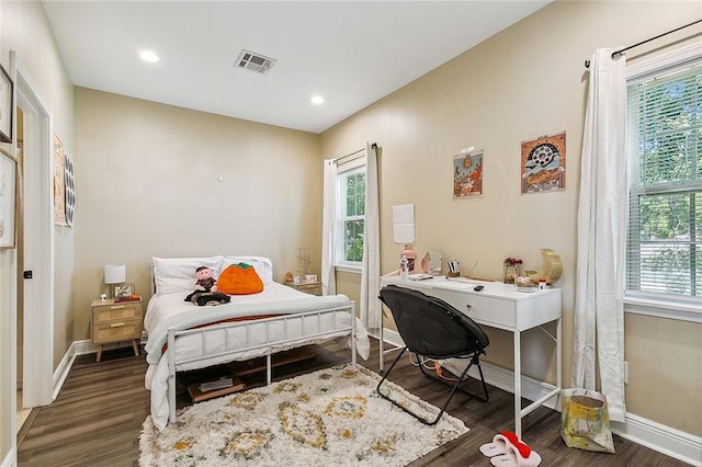 bedroom featuring dark hardwood / wood-style floors