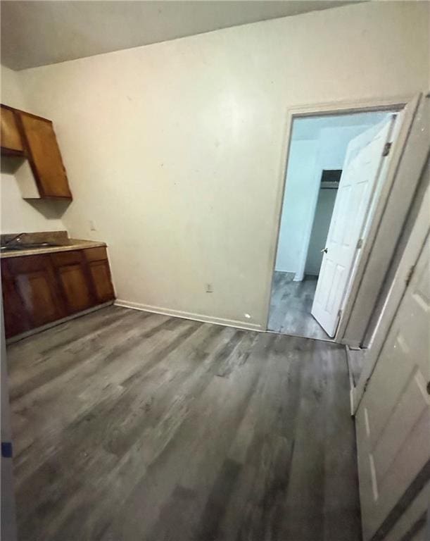 unfurnished dining area featuring dark hardwood / wood-style flooring