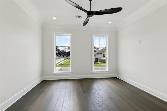 empty room featuring ceiling fan, crown molding, and dark wood-type flooring