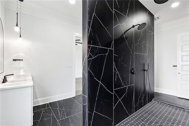 bathroom featuring crown molding, vanity, and walk in shower