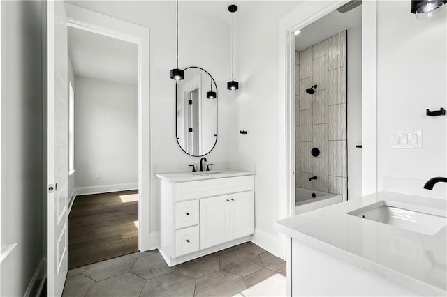 bathroom featuring tile patterned floors, shower / tub combination, and vanity