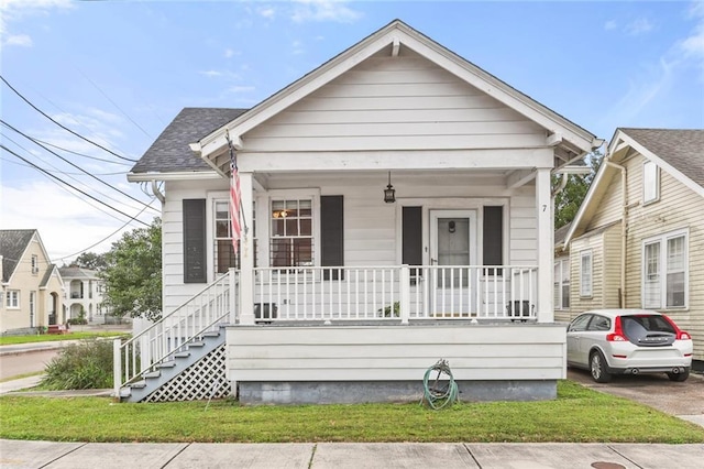 bungalow-style house featuring a front yard