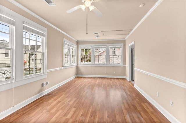 unfurnished sunroom with ceiling fan