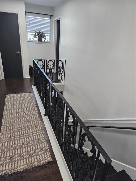 staircase with hardwood / wood-style flooring and mail boxes