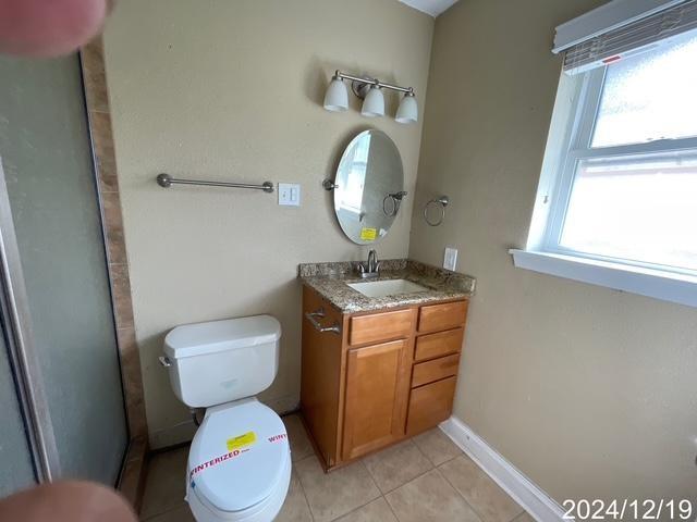 1809 W Frisco Dr, La Place, LA 70068 - bathroom featuring tile patterned flooring, vanity, and toilet