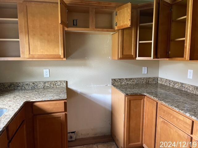 1809 W Frisco Dr, La Place, LA 70068 - kitchen featuring dark stone countertops