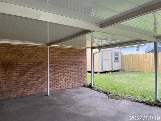 1809 W Frisco Dr, La Place, LA 70068 - view of patio / terrace featuring a storage shed