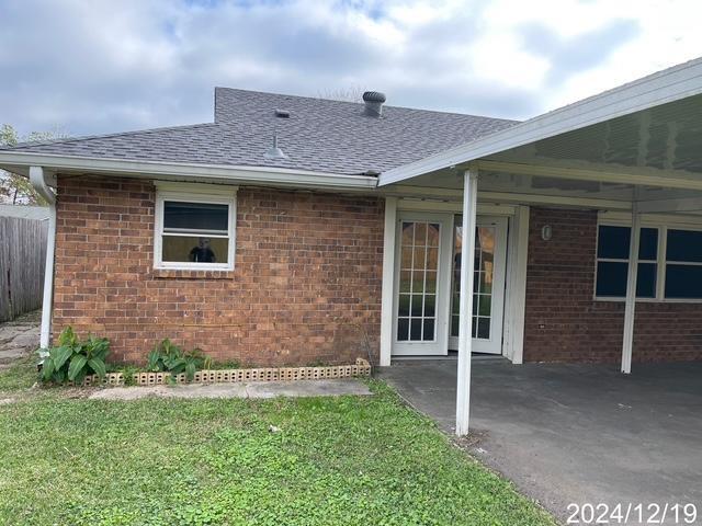 1809 W Frisco Dr, La Place, LA 70068 - doorway to property with a yard and a patio