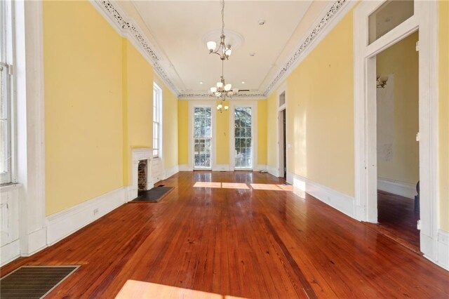 1432 Magazine St, New Orleans, LA 70130 - interior space featuring a chandelier, hardwood / wood-style floors, and crown molding