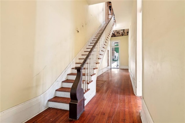 1432 Magazine St, New Orleans, LA 70130 - staircase with hardwood / wood-style floors