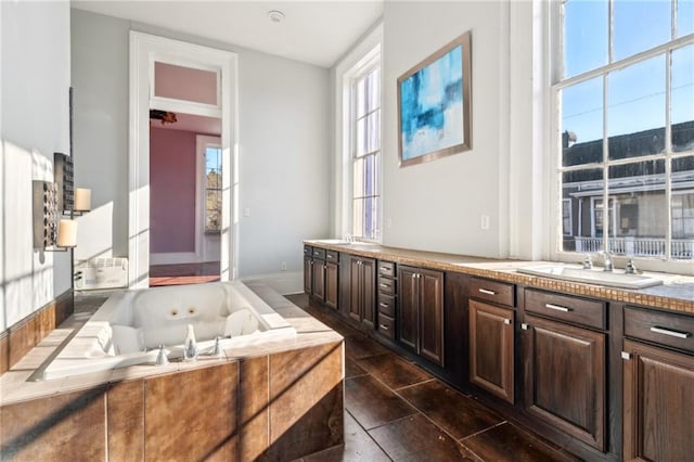 1432 Magazine St, New Orleans, LA 70130 - bathroom with vanity and a relaxing tiled tub