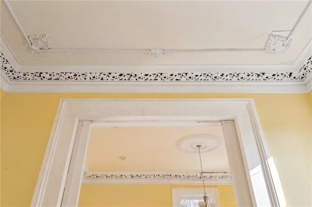 1432 Magazine St, New Orleans, LA 70130 - room details featuring crown molding and a chandelier