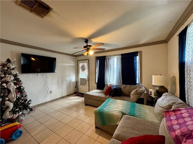 living room featuring ceiling fan, light tile patterned floors, and crown molding