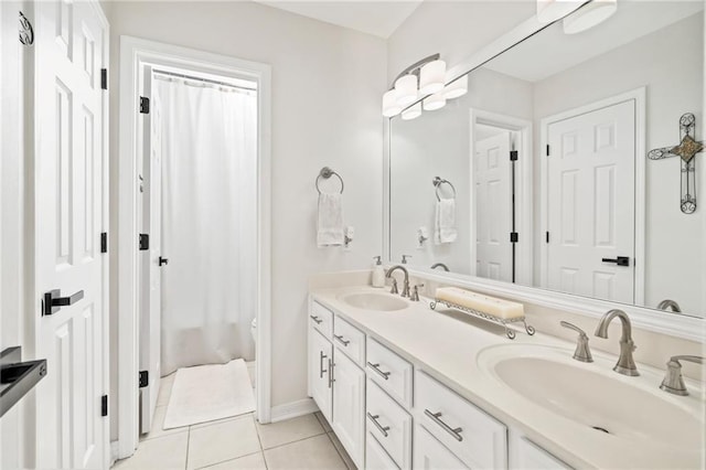 bathroom featuring tile patterned flooring and vanity