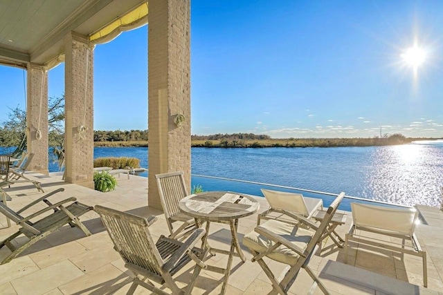 view of patio / terrace featuring a water view