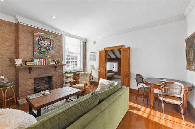 living room with wood-type flooring, a brick fireplace, and ornamental molding