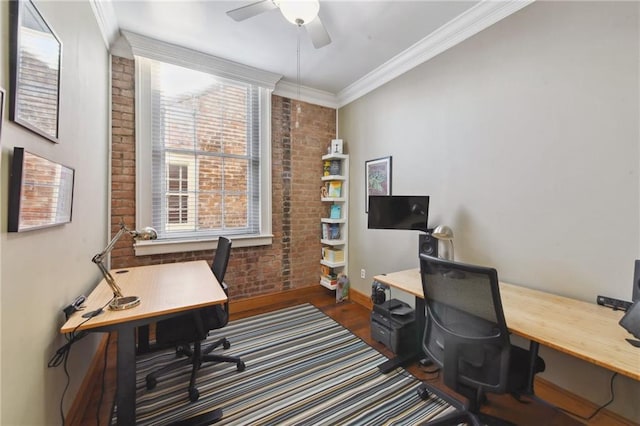 office space featuring a wealth of natural light, ceiling fan, and brick wall