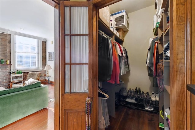 walk in closet featuring hardwood / wood-style flooring