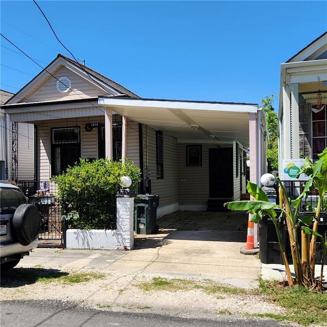 view of front of property featuring a carport