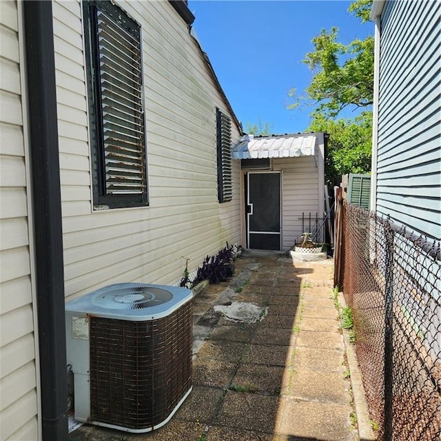 view of side of home with cooling unit