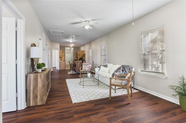 living room featuring ceiling fan and dark hardwood / wood-style floors