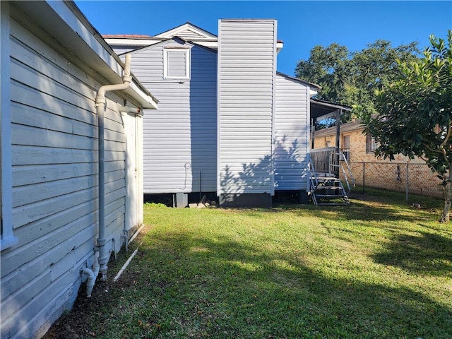 view of home's exterior with a yard