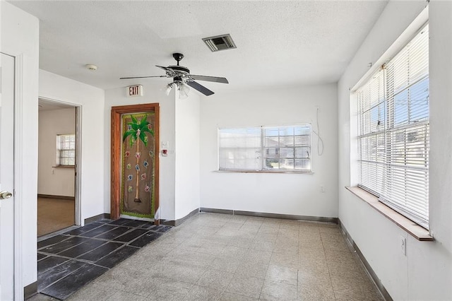 foyer featuring ceiling fan