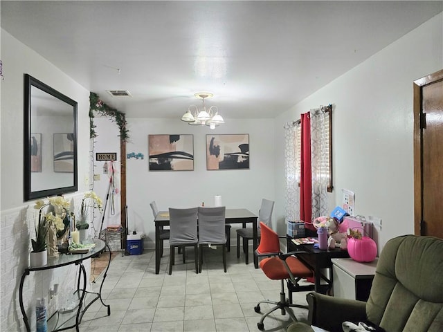 dining room featuring a notable chandelier