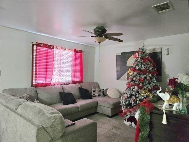 living room featuring light tile patterned floors and ceiling fan