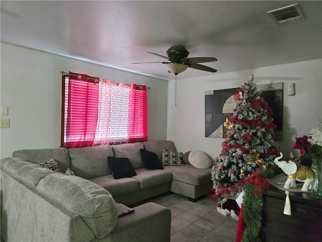 tiled living room featuring ceiling fan