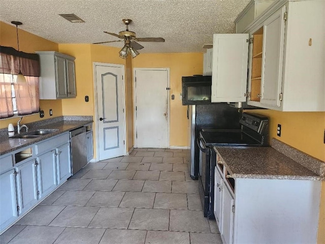 kitchen featuring ceiling fan, sink, black range with electric cooktop, stainless steel dishwasher, and a textured ceiling