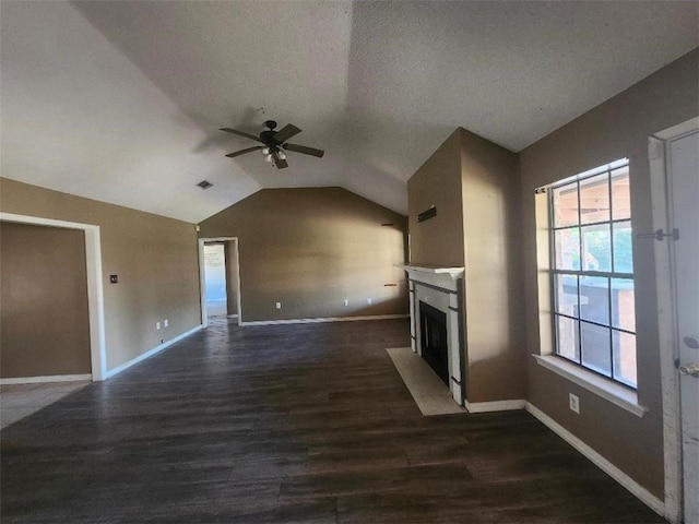 unfurnished living room with vaulted ceiling, ceiling fan, and dark hardwood / wood-style floors