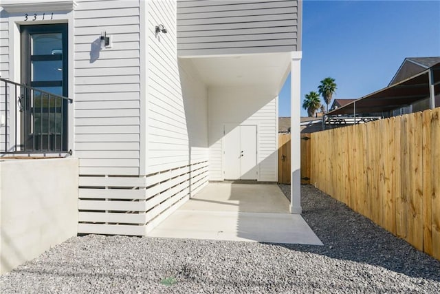 view of side of home with a patio