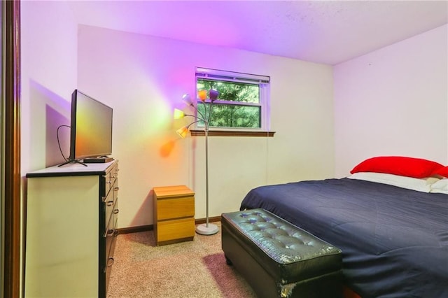 bedroom featuring light colored carpet