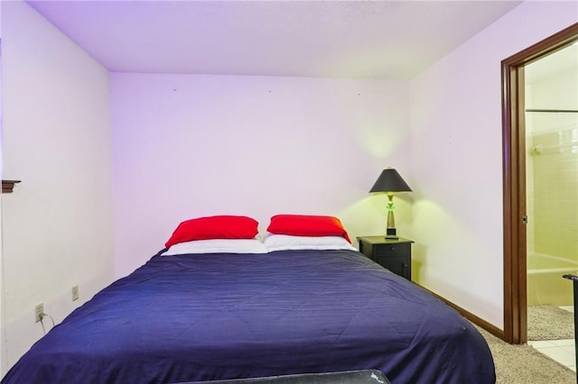 carpeted bedroom featuring connected bathroom