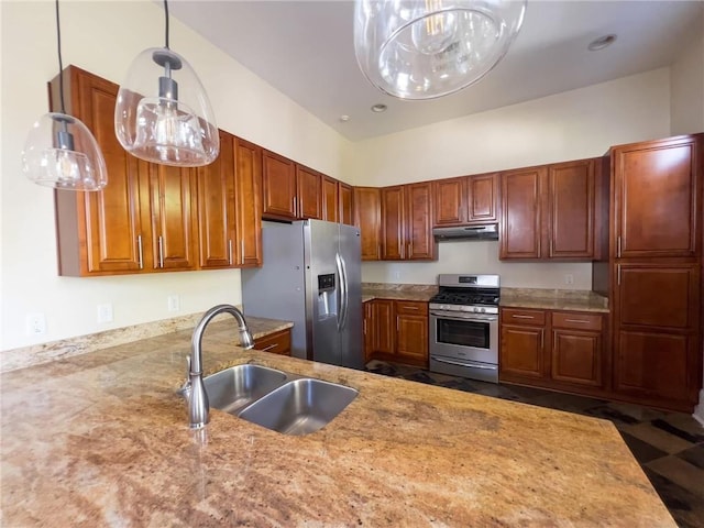 kitchen with sink, hanging light fixtures, light stone counters, kitchen peninsula, and appliances with stainless steel finishes