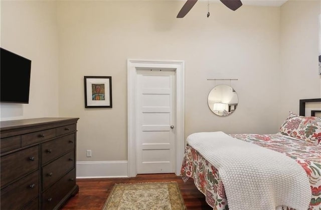 bedroom with ceiling fan and dark hardwood / wood-style flooring