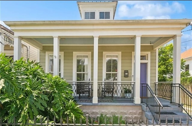 property entrance with covered porch