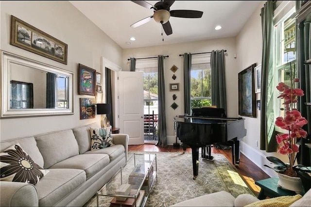 interior space with ceiling fan and wood-type flooring