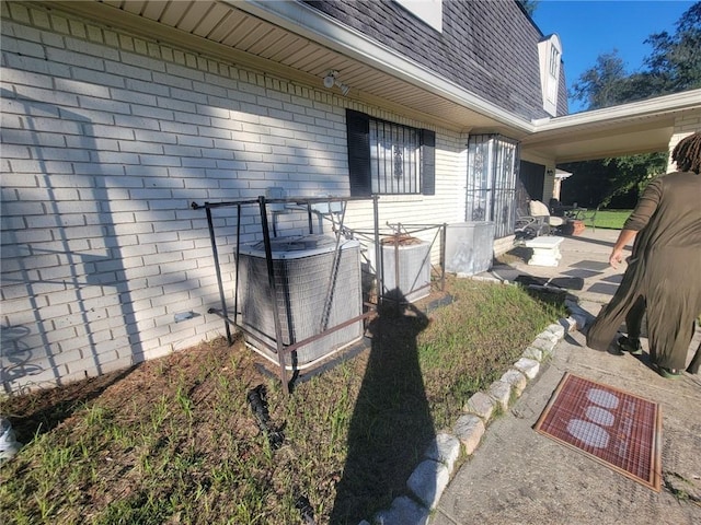 view of side of home with cooling unit