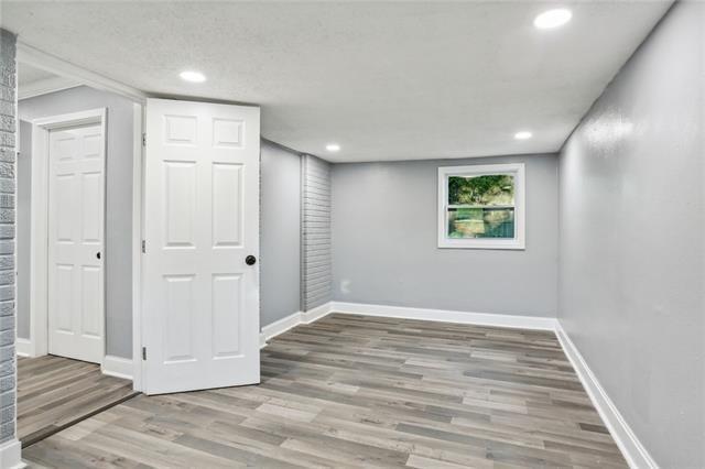 basement featuring hardwood / wood-style flooring