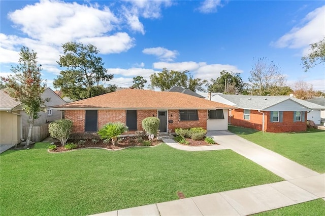 ranch-style house featuring driveway, a front lawn, and brick siding